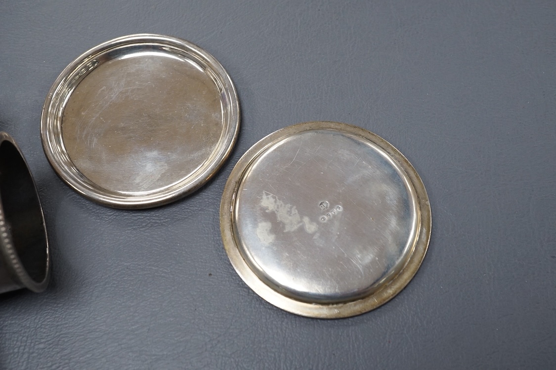 A pair of 19th century tripod salts, height 60mm, together with eight assorted silver napkin rings and a pair of small Victorian silver coasters?, 16.5oz.